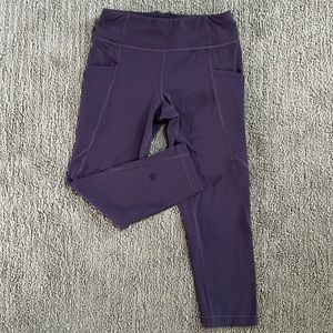 Athleta Girl “Stash Your Treasures Capri” leggings. Size M/8-10. Dark purple.